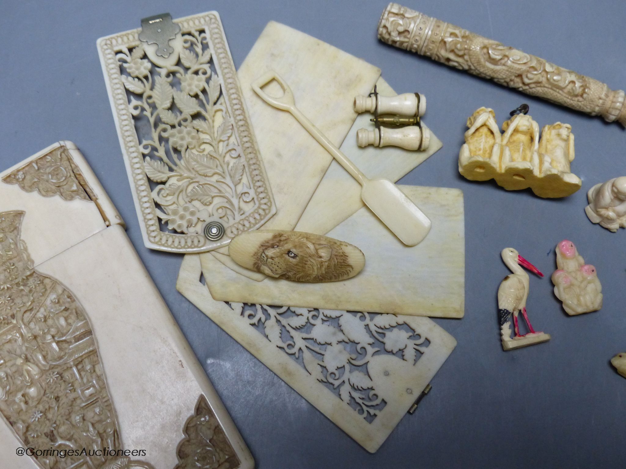 A late 19th century Chinese carved ivory card case, a similar needle case, an aide-memoire and sundries